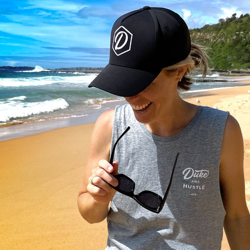Black 5 Panel Cap with White Thread D&H Icon, modelled by Ash
